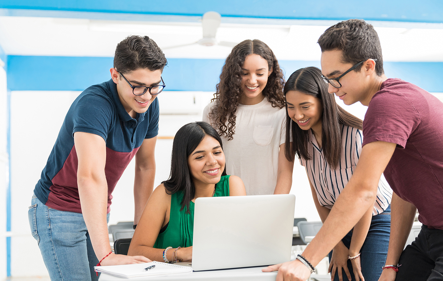 Students looking at a laptop